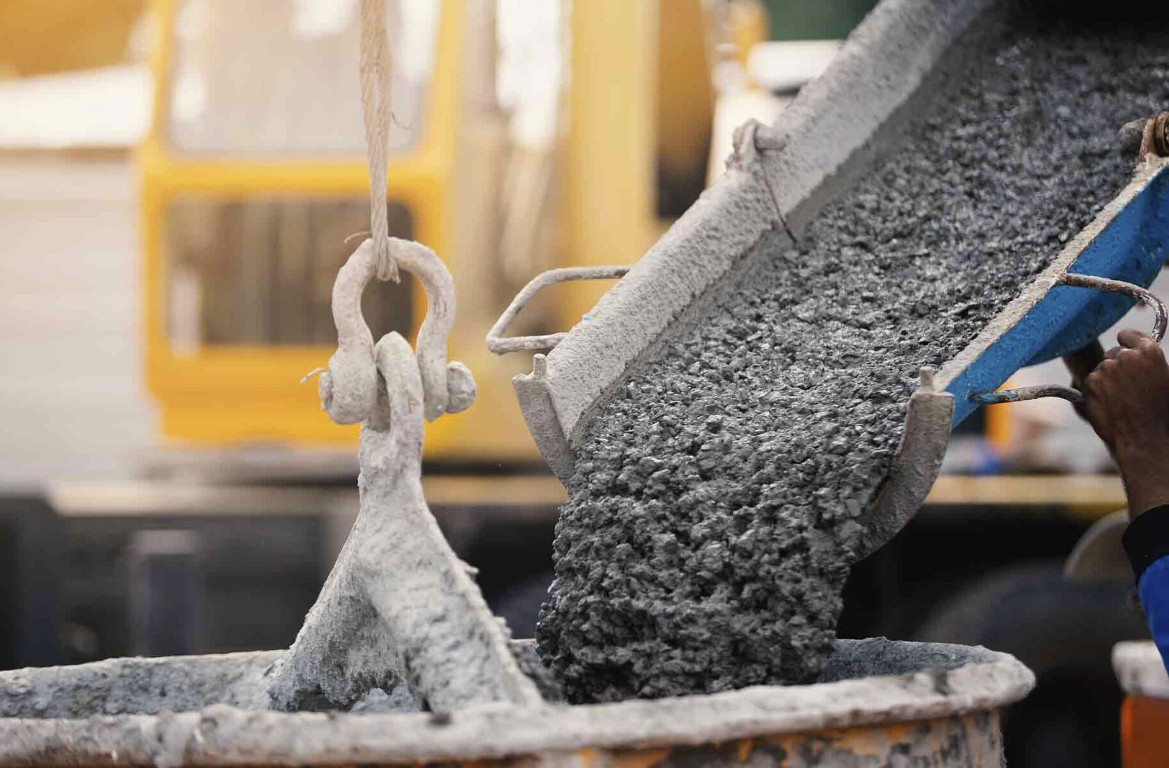 Concrete contractor pouring fresh concrete for steps and stairs installation in Bradenton, FL