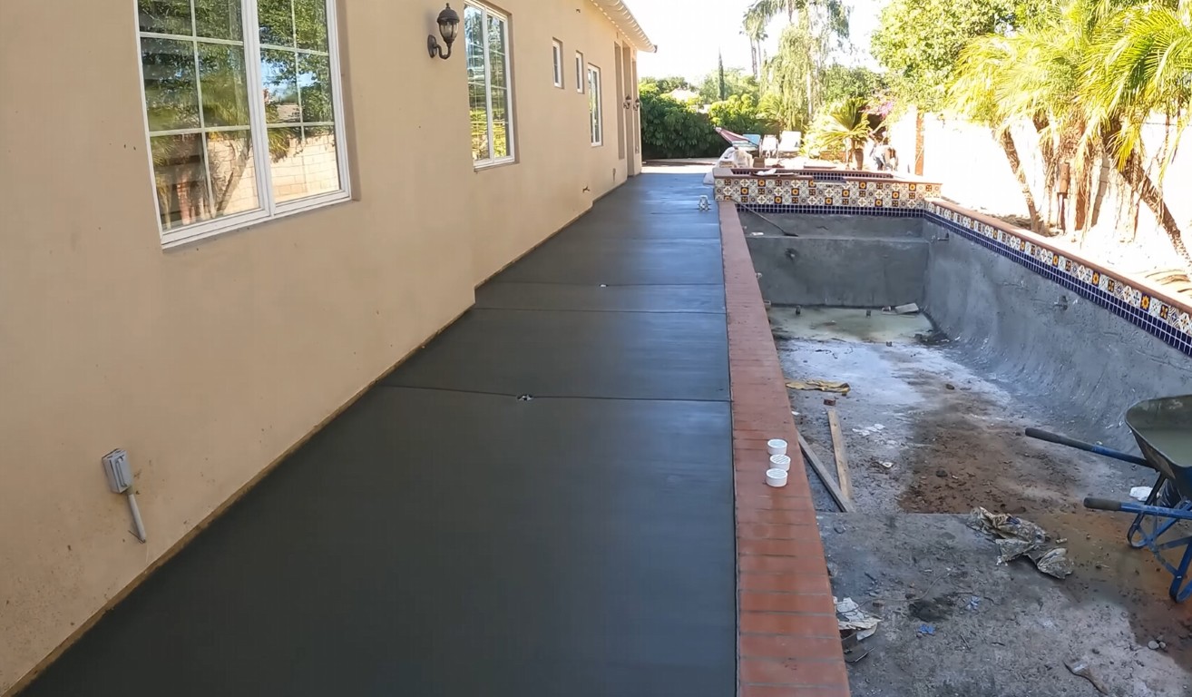 Level concrete pool deck installation showing precision grading in Bradenton, FL